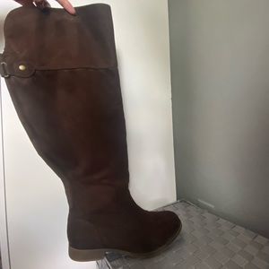 Brown suede high thigh boots.